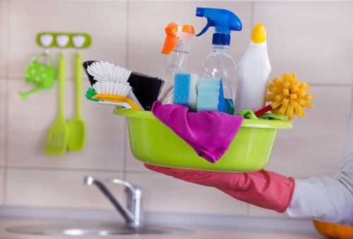 Builders cleaning after renovation in a Brixton home