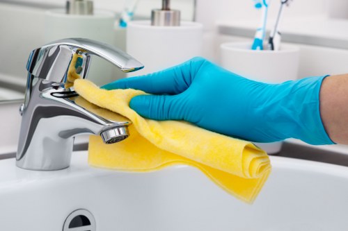 Professional upholstery cleaning equipment being used on a sofa